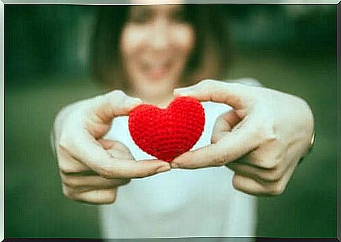 Woman with crocheted heart.