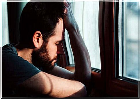 A sad man by the window.