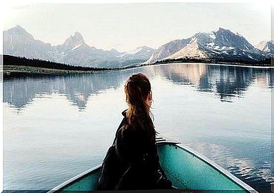 Cheek in rowing boat on lake