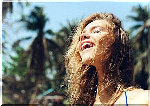 A woman who enjoys the sunlight and feels happy