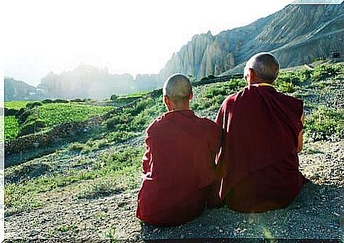 Tibetan monks enjoy the view.