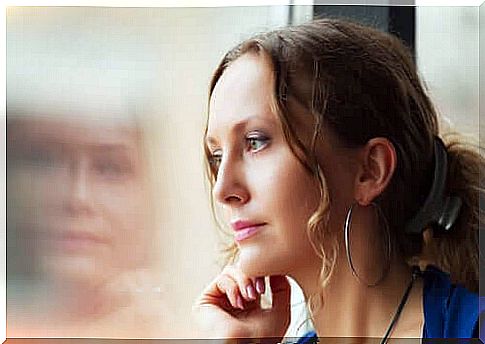 A woman who looks out the window and thinks of moral dilemmas.