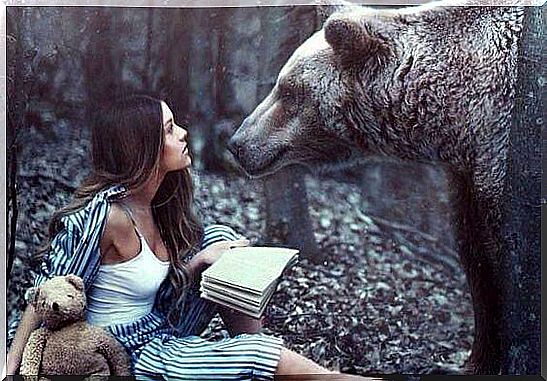 Woman and bear in the forest