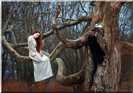 Woman sitting in wood