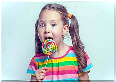 A girl with a lollipop.